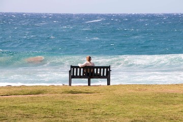 Solitary Female Sitting on Wooden Bench