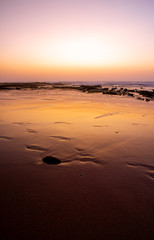 Glowing sand at sunset in Monte Clerigo, Algarve (Portugal)