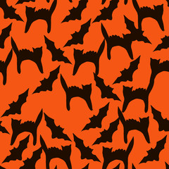 Halloween seamless vector pattern for your design  with black silhouette of pumpkins, cats, spiders and witches on a orange background