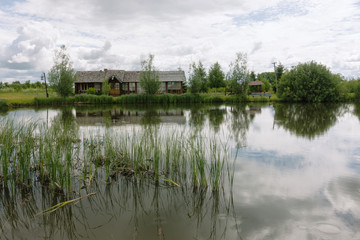 Fototapeta na wymiar The house by the pond. Lake Nero. Rostov the Great
