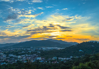 Fototapeta na wymiar sunset at Khao Rang the landmark viewpoint of Phuket city. Khao Rang viewpoint on hill top in the middle of Phuket town on hill top can see the great big Buddha too.