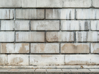 White brick wall background and concrete floor.