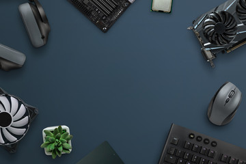 Computer shop and service work desk with pc components and copy space in the middle.