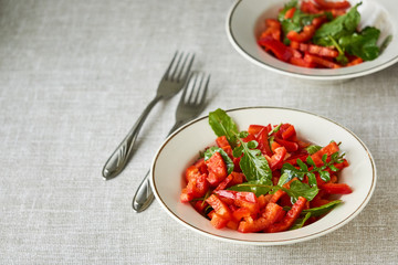 Vegetable salad with red bell pepper and arugula 