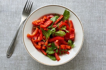Vegetable salad with red bell pepper and arugula 