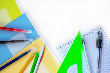 A lot of multi-colored school and office supplies on a white background. Back to school. Copyspace for text