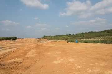 Fototapeta na wymiar Construction site dirt road and mound perspective view