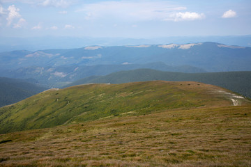 Fototapeta premium Beautiful landscape of mountains and forests against the blue sky. Travel concept.