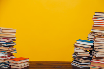 stacks of educational books university library background