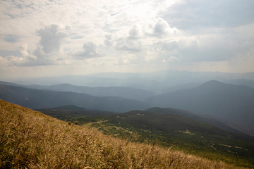 Beautiful landscape of mountains and forests against the blue sky. Travel concept.