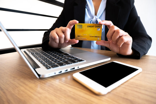 Business woman consumer holding credit card and smartphone for online shopping and payment make a purchase on the Internet