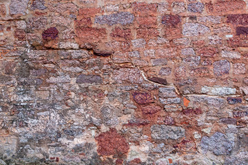 Masonry. Vintage wall of rusty stone Rusted texture