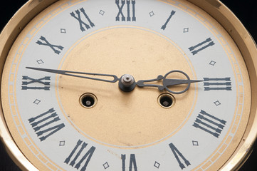 Close up old antique classic clock. Retro style. Vintage background.
