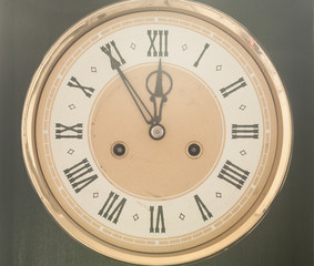 Old clock with roman numerals.
