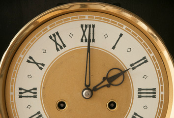 Close up old antique classic clock. Retro style. Vintage background.