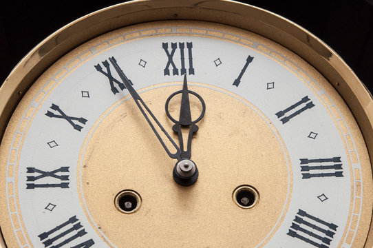 Old clock with roman numerals.