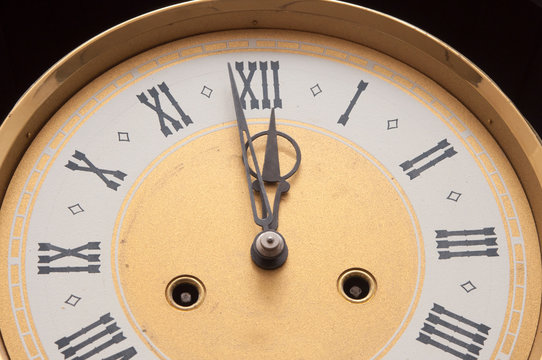 Old clock with roman numerals.