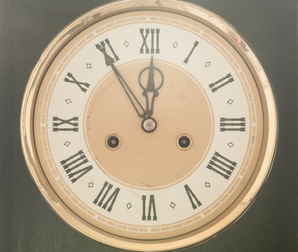 Old clock with roman numerals.