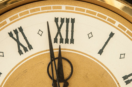 Old clock with roman numerals.