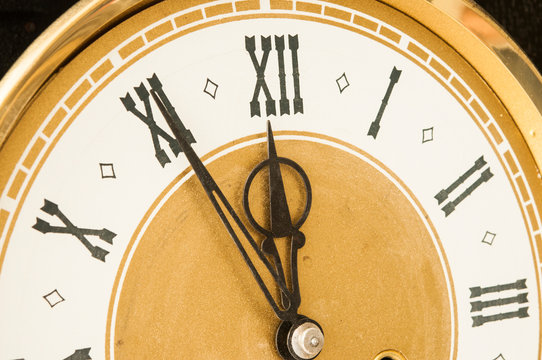 Old clock with roman numerals.