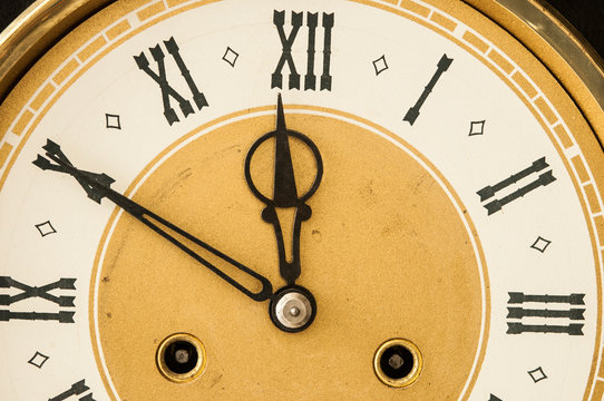 Old clock with roman numerals.