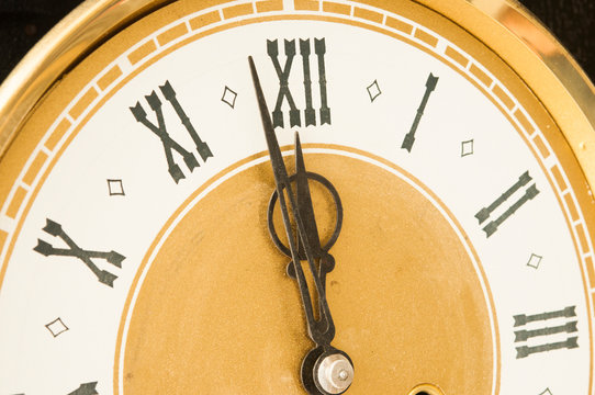 Old clock with roman numerals.