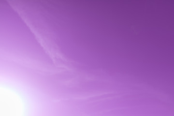 Calm concept: Abstract blur beautiful purple and pink sky, sun background.Sun in a purple sky.