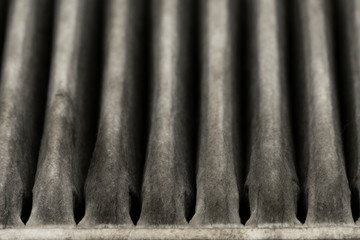 Old dirty automotive engine air filter for background texture