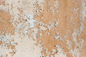 background texture of old peeling beige paint on the wall