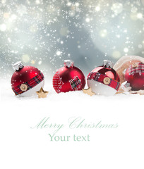 Christmas red ball in snow with blur celebration background. 