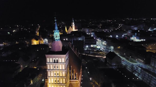 Aerial night View Of a city hall in Olsztyn Old Town, Poland