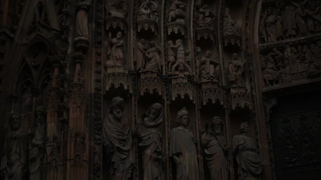 Strasbourg Notre-Dame cathedral, Alsace, France. Closeup of Saints sculpture on the exterior of church building. Old town gothic architecture, catholic religion, travel landmark.