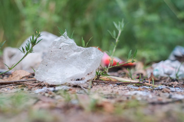 Garbage from plastic bags that are thrown away on the ground which is a problem and pollution to the environment.