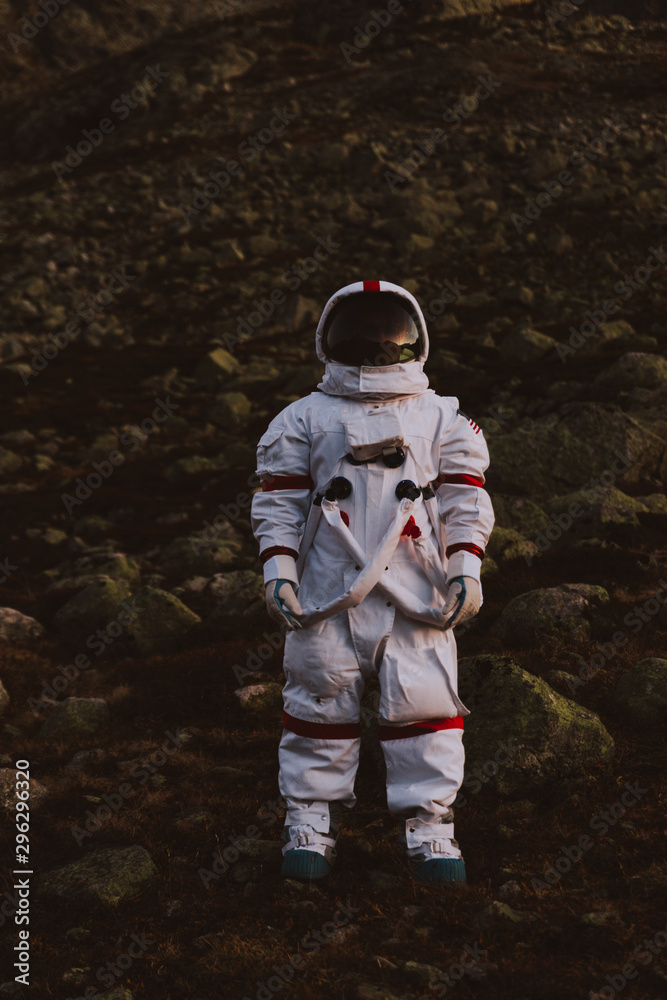 Poster astronaut exploring a new planet. searching for a new home for humanity. concept about science and n