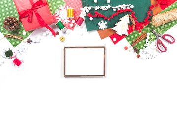 Merry Christmas Template banner with mock up christmas frame. Gift wrapping workspace. Decoration presents making flat lay top view Xmas celebration preparation DIY concept decor white background.