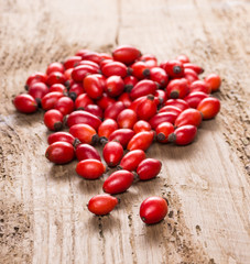 Rose hip on a wooden background