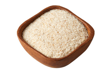 Psyllium (ispaghula) husk in wooden bowl isolated on white background