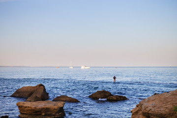 The rocky coast of the Black Sea in the Odessa region in Ukraine, view of the yachts.