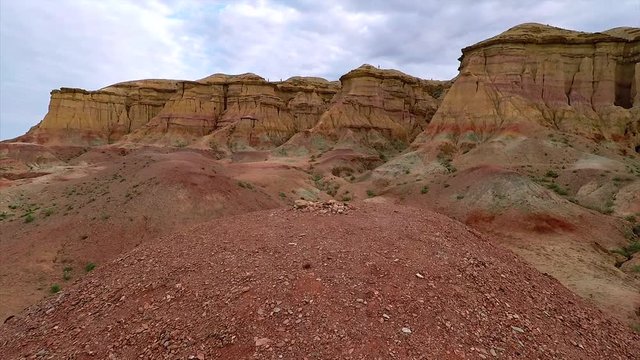 Mongolia - Walking on a hill of the Bayanzag site in the Gobi desert