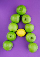 letter A composed of apples in lemon