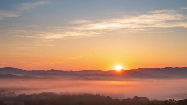 4K Timelapse of sunrise at misty morning, Tuscany, Italy