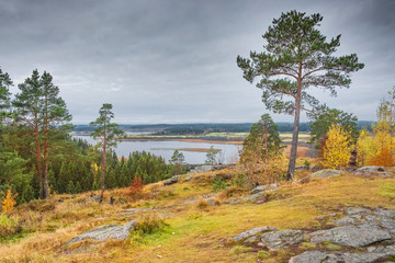 Fototapeta na wymiar view of autumn Karelia from the height of the hillfort on Mount Paaso near the town of Sortavala