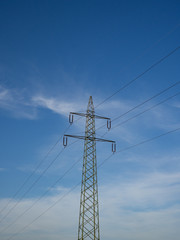 Electricity pylon and blue sky and clouds