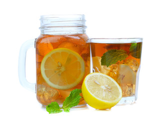 iced tea with lemon slices and mint on white background