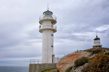 Fototapeta na wymiar Tourinan Lighthouse in Muxia, Galician coast. Northern Spain