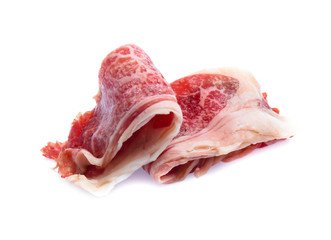 Fresh raw beef meat slices isolated over white background