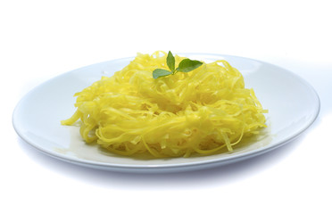 yellow noodles on dish isolated on white background