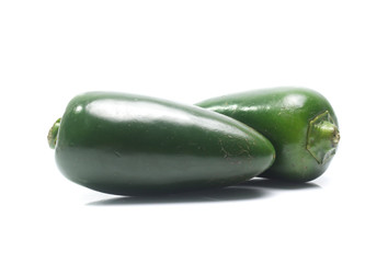 green chilies on white background (jalapeno)