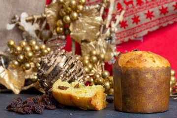 Christmas Panettone with slice and Christmas setting. Typical Italian Christmas holiday cake