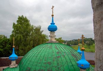 The dome of the Church with Golden crosses against the stormy sky.